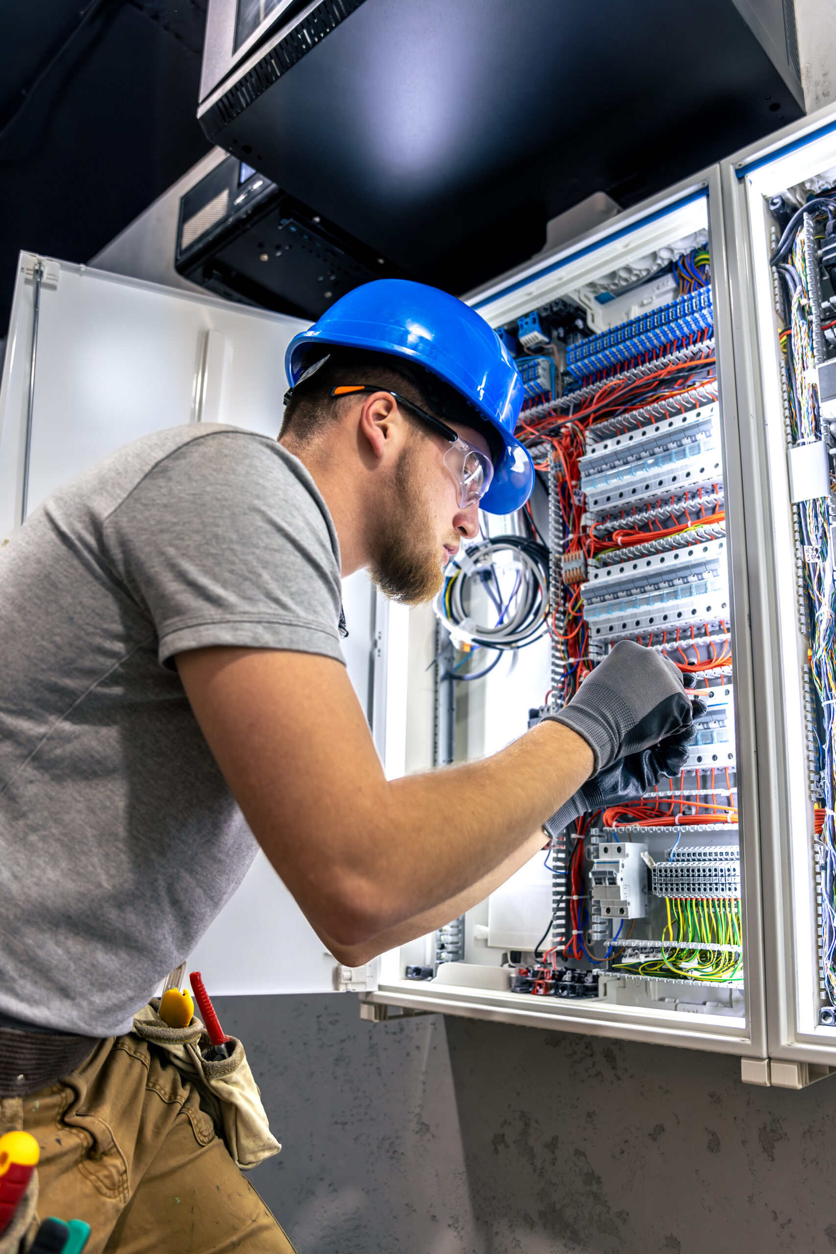 male electrician uniform working switchboard electricity scaled.jpg